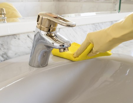 Staff member trained in carpet cleaning procedures and safety checks